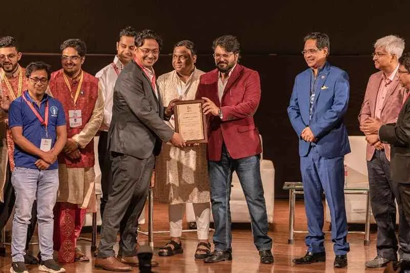 Invesmate honoured with an award on stage